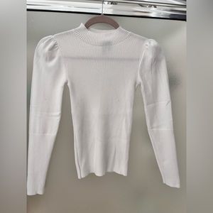 White mock neck top with puff sleeve detail